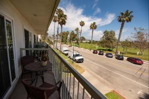 a balcony with a view of a street with cars at Beautiful 1 Bed Beach Balcony Condo #207 in Carpinteria
