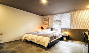 Gimhae Browndot Hotel Waterpark客房内的一张或多张床位