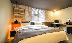 Gimhae Browndot Hotel Waterpark客房内的一张或多张床位