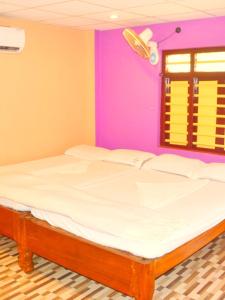 Postel nebo postele na pokoji v ubytování Sunset Beach Resort