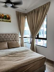 a bedroom with a bed and a large window at Homestay Ayer Keroh, MiTC , UTEM, Bukit Beruang in Ayer Keroh