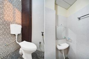 a bathroom with a toilet and a sink at Hotel O Deva road Formerly Hotel Sunrise Inn in Lucknow