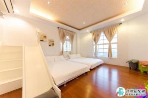 Un pat sau paturi într-o cameră la Beauty Monroe B&B