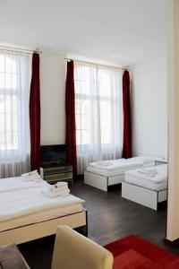 Postel nebo postele na pokoji v ubytování GLS Studio Hotel Berlin