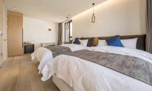 Postel nebo postele na pokoji v ubytování Dobong Hotel Bay204