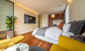 TV a/nebo společenská místnost v ubytování Dobong Hotel Bay204