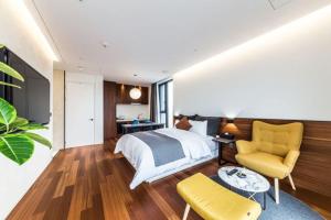 Postel nebo postele na pokoji v ubytování Dobong Hotel Bay204