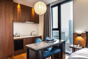 Kuchyň nebo kuchyňský kout v ubytování Dobong Hotel Bay204