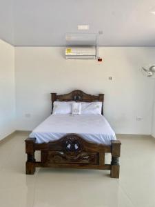 Postel nebo postele na pokoji v ubytování Hotel Pablo Jaraba Diaz