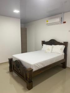 Postel nebo postele na pokoji v ubytování Hotel Pablo Jaraba Diaz