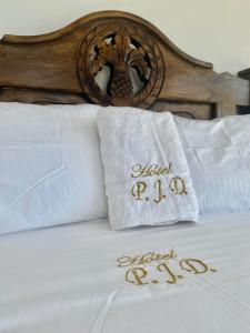 Postel nebo postele na pokoji v ubytování Hotel Pablo Jaraba Diaz