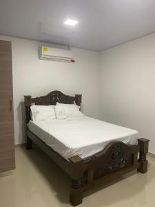 Postel nebo postele na pokoji v ubytování Hotel Pablo Jaraba Diaz