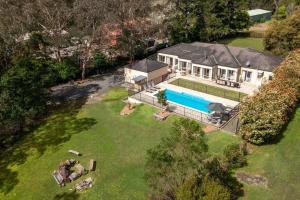 an aerial view of a house with a swimming pool at Westbrook, Kangaroo Valley in Kangaroo Valley