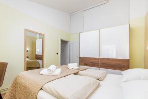 Posteľ alebo postele v izbe v ubytovaní Apartments Ana-Maria