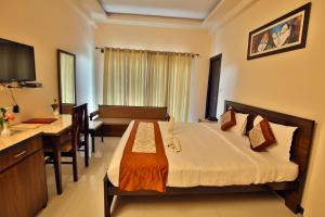 Postel nebo postele na pokoji v ubytování Mountain River Valley Resort Udaipur