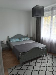 Posteľ alebo postele v izbe v ubytovaní ul.Powstania Wielkopolskiego 18