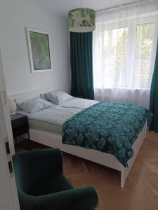 Posteľ alebo postele v izbe v ubytovaní ul.Powstania Wielkopolskiego 18