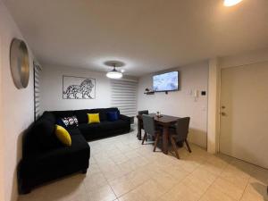 a living room with a couch and a table at León in Guadalajara