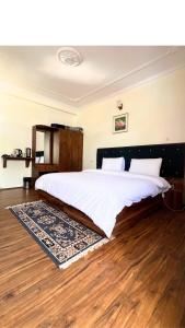 Postel nebo postele na pokoji v ubytování Hotel Chitkul