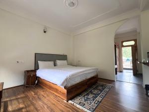 Postel nebo postele na pokoji v ubytování Hotel Chitkul