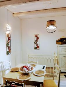 a kitchen with a table with bowls of food on it at Dimora Egnazia in Savelletri di Fasano