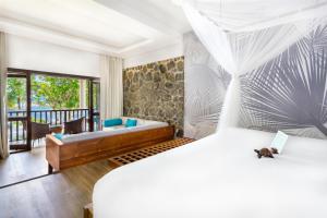 Letto o letti in una camera di Kempinski Seychelles Resort