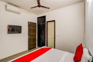 Ένα ή περισσότερα κρεβάτια σε δωμάτιο στο Hotel O PubG Residency