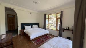 Postel nebo postele na pokoji v ubytování Hotel Chitkul
