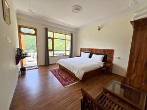 Postel nebo postele na pokoji v ubytování Hotel Chitkul