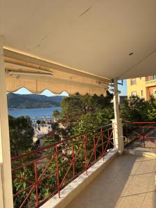 a balcony with a view of the water at Soul Home in Iraklitsa
