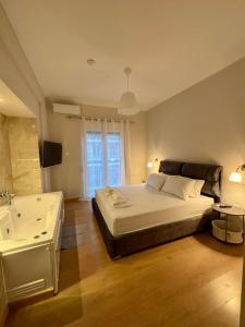 Ένα ή περισσότερα κρεβάτια σε δωμάτιο στο Elysian Αpartment II +19 φωτογραφίες