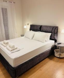 Ένα ή περισσότερα κρεβάτια σε δωμάτιο στο Elysian Αpartment II