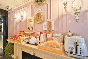 a counter with food and a toaster on it at Daegu February Hotel Suseong in Daegu
