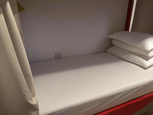 Postel nebo postele na pokoji v ubytování Peking Youth Hostel