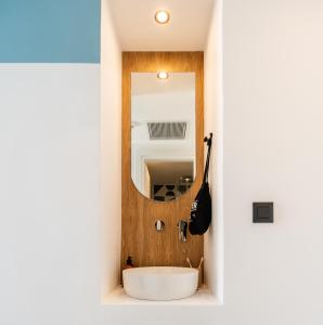 a bathroom with a sink and a mirror at Play Paros in Kampos Paros