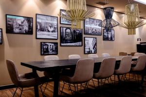 a dining room with a table and chairs at Motel One Prague-Florentinum in Prague