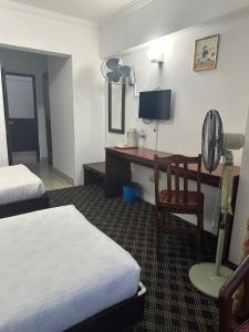 Voodi või voodid majutusasutuse Fuji Hotel toas