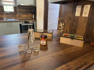 a kitchen with a wooden counter with glasses on it at Casa Spiladia in Chios