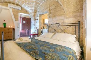 Postel nebo postele na pokoji v ubytování B&B Demetra Appartamenti