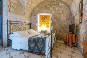 Postel nebo postele na pokoji v ubytování B&B Demetra Appartamenti