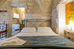 Postel nebo postele na pokoji v ubytování B&B Demetra Appartamenti