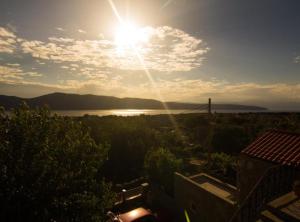 a view of the sun rising over the water at Apartment Jadranka (Magdic) in Krk