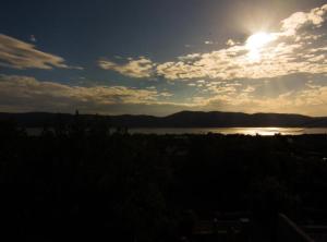 a sun setting over a body of water at Apartment Jadranka (Magdic) in Krk