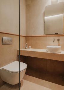 a bathroom with a toilet and a sink at Hotel Apollon Corfu in Paleokastritsa