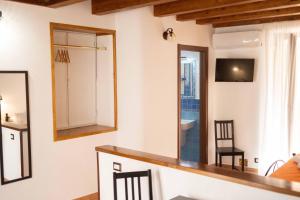 a mirror on the wall of a room with a bathroom at Dalì alla rocca in Cefalù