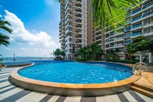 a large swimming pool in front of a building at Danga Bay Country Garden by Short Escape in Johor Bahru