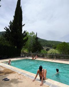 a group of people in a swimming pool at Cortijo Los Gorros in Moratalla +17 photos