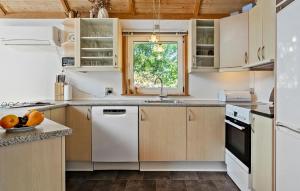 a kitchen with white appliances and a window at Lovely Home In Børkop With Wifi in Børkop