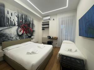 Postel nebo postele na pokoji v ubytování InscìBell Guest House