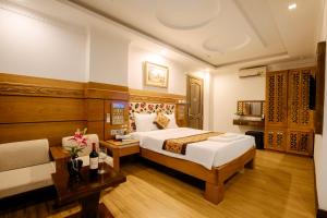 Postel nebo postele na pokoji v ubytování A9 Beach Hotel Da Nang